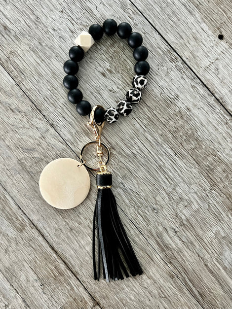 Wristlet with tassel and pendant