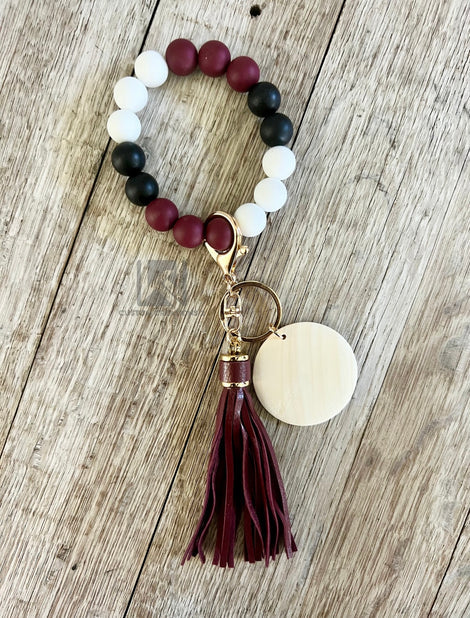 Wristlet with tassel and pendant
